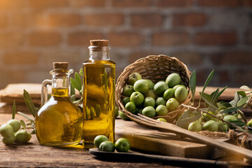 Olives and olive oil in a bottles - 497715268