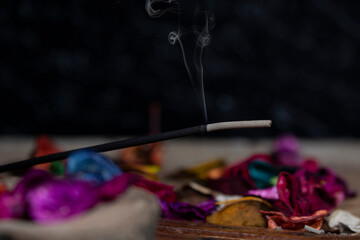 incense stick and smoke on wooden table