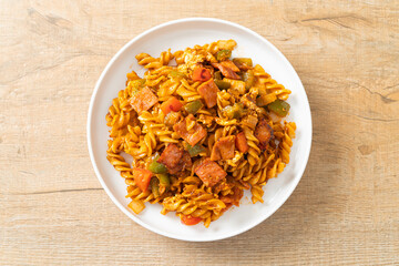 fusilli pasta with ham and tomatoes sauce