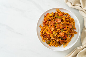 fusilli pasta with ham and tomatoes sauce
