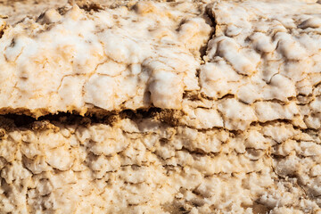 Closeup salt on the coast of a natural Salt water lake in desert. Oasis in Siwa, Egypt. 