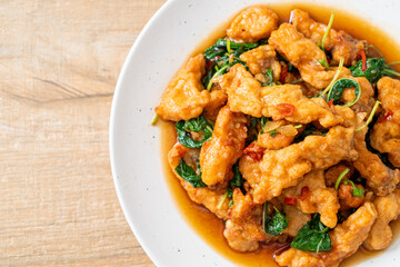 stir-fried fried fish with basil and chili in thai style