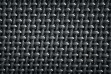 Macro photography of a speaker with mesh wicker texture pattern.