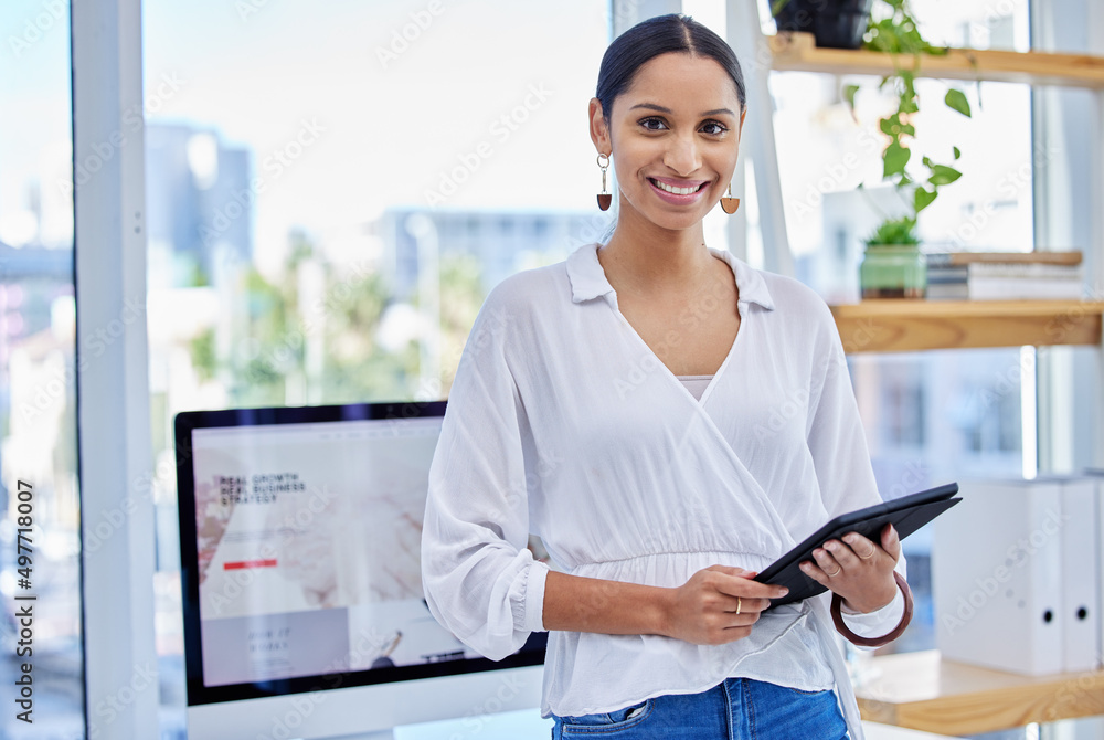 Poster disaster in my past, no boundaries in my path. shot of a businesswoman using a digital tablet in a m