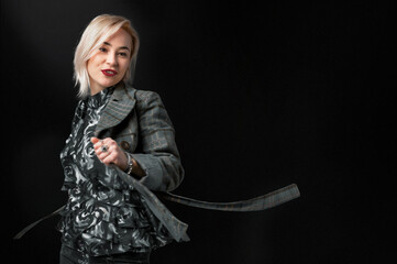 Beautiful dancing woman on dark black background