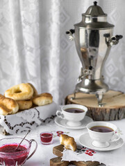 Traditional Ukrainian tea with teapot samovar and delicious bagel