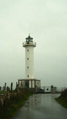 road that leads to the lighthouse raining