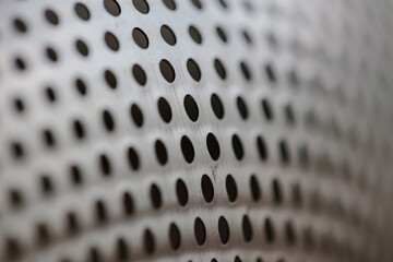 Metal fragment, chrome-plated surface with perforations in the form of round holes, metal colander....
