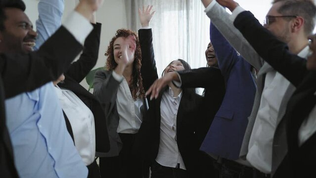 Multiracial business people stacking hands together in modern office - Teamwork concept