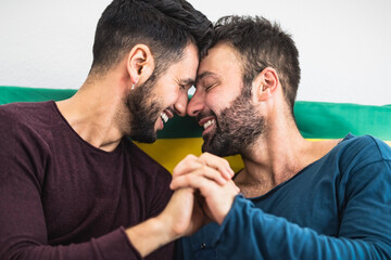 Fototapeta premium Happy gay couple having romantic moments in bed - Homosexual love relationship and gender equality concept