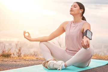 Find your balance in life. Shot of a young woman meditating in nature.