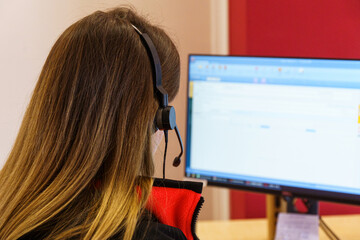 Call center Customer support. Woman talking with clients. Close up shot of headphones