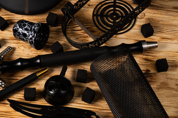 hookah equipment, wooden background, flask, bowl, plate, mouthpiece