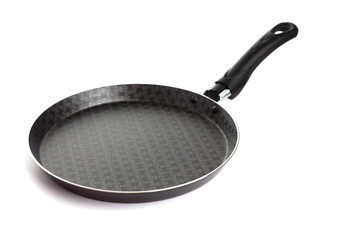 new Black pancake pan with non-stick coating on an isolated background - obrazy, fototapety, plakaty