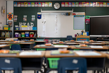 Wide angle view of empty elementary school classroom in the US.
