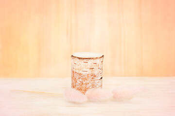saw cut of a tree on a wooden background with dried flowers