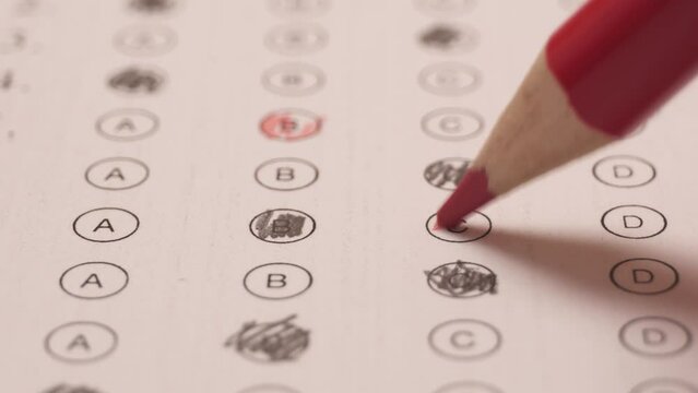 Shading With Red Pencil The Chosen Correct Answer In Multiple Choice Exam - close up