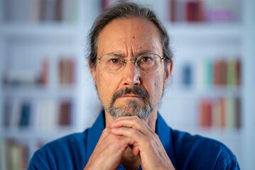 Closeup portrait of successful business man in home office library. Male professional feeling happy receiving new job opportunity, growth concept.