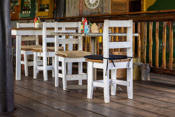 white wooden chairs in a coffee shop