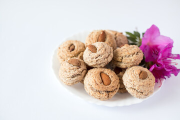 Almendrados, dumplings or typical biscuits made from almonds, sugar and egg white. Almond cakes on white background.