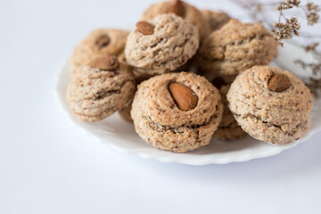 Almendrados, dumplings or typical biscuits made from almonds, sugar and egg whites. Almond cakes on white background.