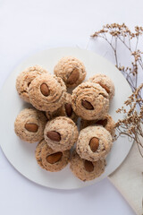 Almendrados, dumplings or typical biscuits made from almonds, sugar and eggwhite. Almond cakes on white background.