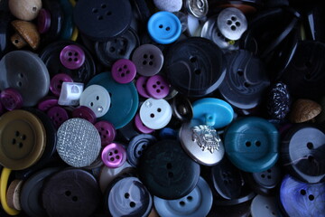 Buttons for clothes, large and small, different colors and shapes. Background for sewing and...