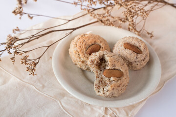 Almendrados, dumplings or typical biscuits made from almonds, sugar and egg yolk. Almond cakes on white background.