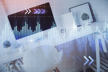 Double exposure of financial graph drawing and office interior background. Concept of stock market.