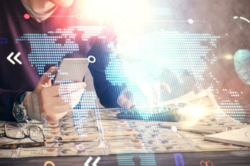 Multi exposure of man's hands holding and using a digital device and map drawing. International...