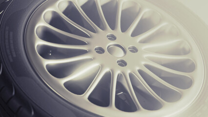 Car rim tire wheel. Depicted perspective on a black background. Close up in high resolution. 3d render