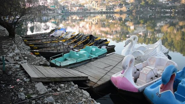 Full view of Naini Lake during evening time near Mall Road in Nainital, Uttarakhand, India, Beautiful view of mountains and blue sky at Nainital Lake side