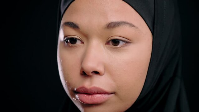 Young woman in hijab crying, family abuse, stop violence, gender equality fight