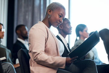The whole world is open, playground for me and you. Shot of a group of businesspeople taking notes during a meeting in an office.