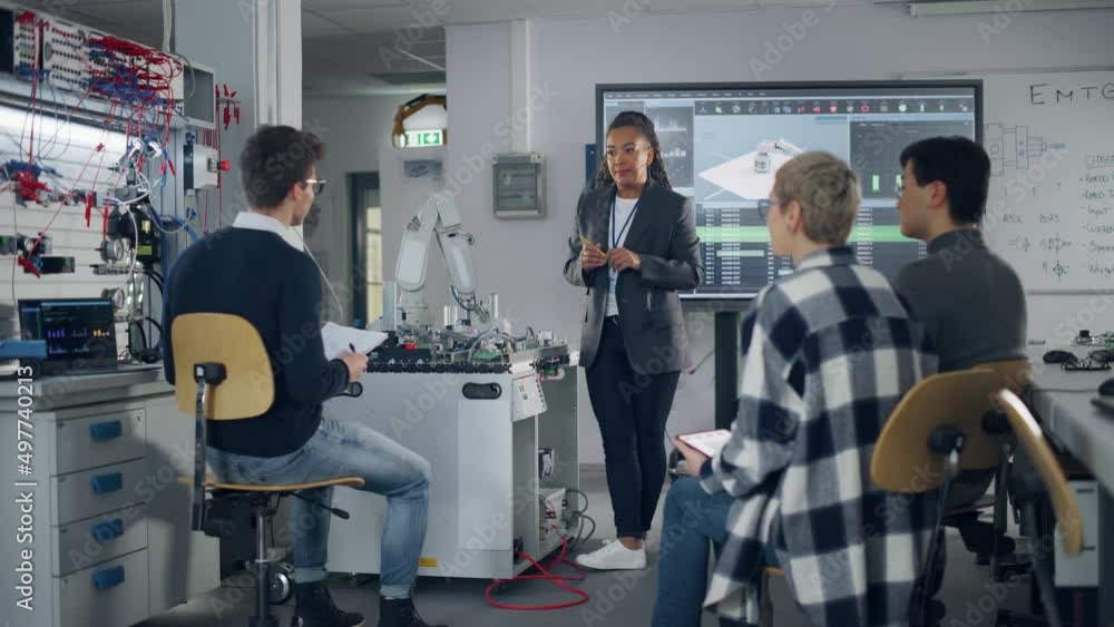 Aufkleber Black Teacher and Diverse Group of Young Students Brainstorming at University Robotics Class. People Discussing with their Educator while Using Robot Arm. Computer Science Education, Design, Learn
