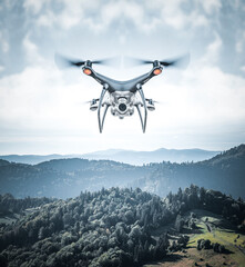 Modern drone in the sky. The drone is flying in the sky.