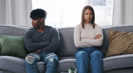 Neither of us are happy. Shot of a young couple having an argument at home.