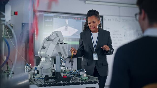 Advanced Robotics Technology Start-up Chief Engineer Presents Innovative Robot Arm at Closed Conference. Futuristic Autonomour Design of AI Robot Hand, Helping to Automate Factory Working