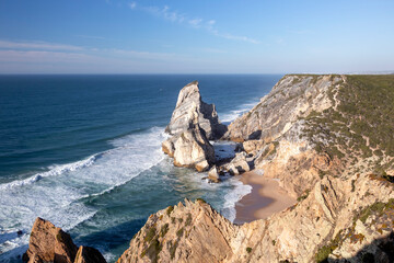 Fototapeta na wymiar Cliffs of the Praia da Ursa beach by Cabo da Roca, between Cascais and Sintra on the Lisbon coast of Atlantic ocean, Portugal