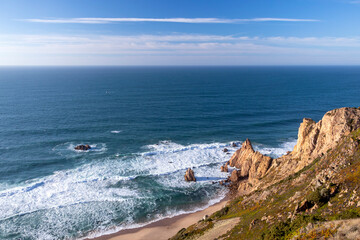 Obraz premium Cliffs of the Praia da Ursa beach by Cabo da Roca, between Cascais and Sintra on the Lisbon coast of Atlantic ocean, Portugal