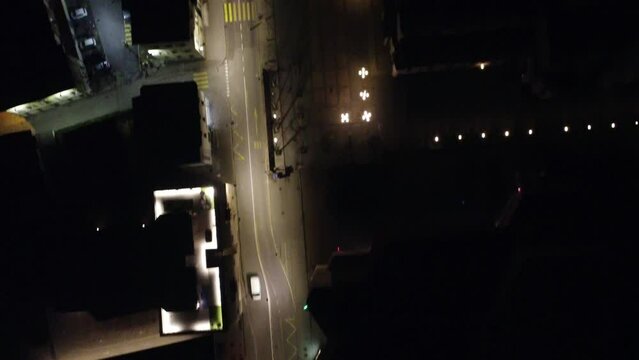 aerial view at night in 4k of the streets of como italy