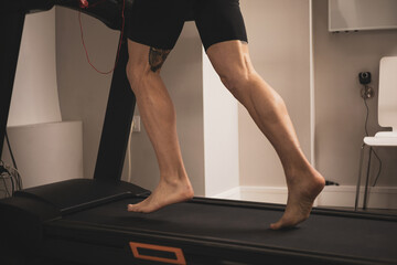 An athlete runs on a treadmill for a gait study.biomechanical study of the foot.