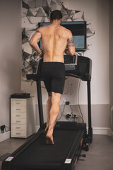 An athlete runs on a treadmill for a gait study.biomechanical study of the foot.