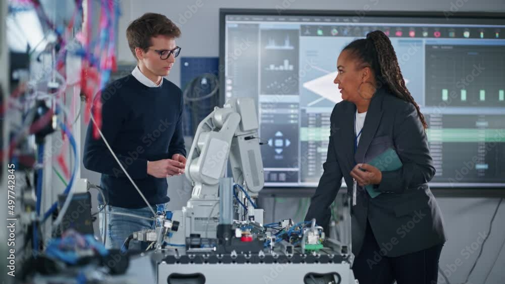 Aufkleber Female Teacher Showing Tablet Screen to Student Man and Discussing Project Details while Bionic Hand is Moving at the Lesson. Lecturer Helping to Pupil with Project. Computer Science Concept