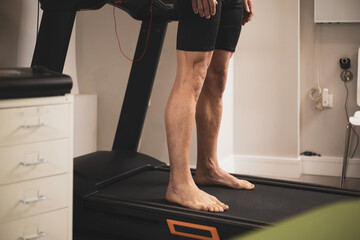 the detail of some legs on a treadmill.biomechanical study of the foot.