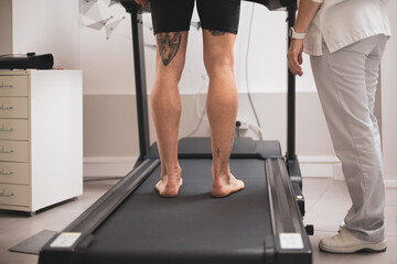 the detail of some legs on a treadmill.biomechanical study of the foot.