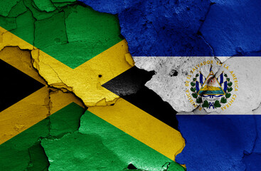 flags of Jamaica and El Salvador painted on cracked wall