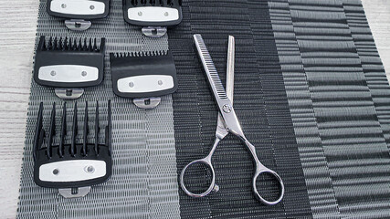 Special hairdressing scissors and comb. Professional equipment.