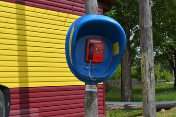 a new street payphone on an old pole