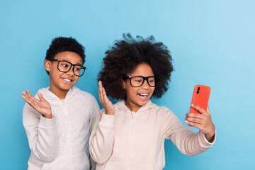 Portrait of small little friends friendship trendy cheery kids taking selfie waving hi isolated...